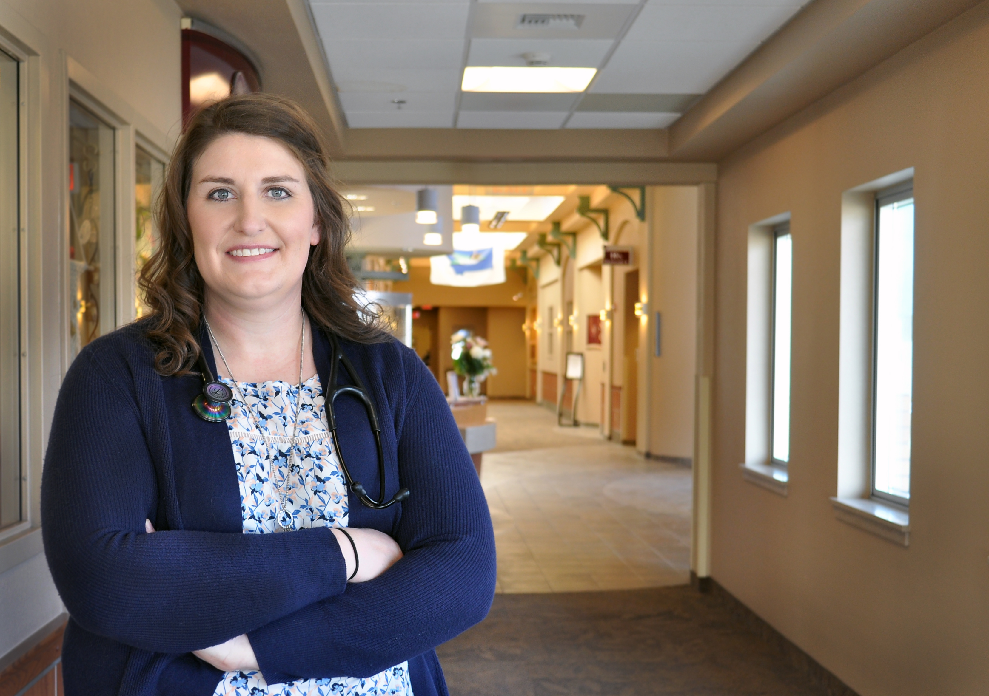 Dr. Elizabeth Brown, OBGYN in front entrance of Glendive Medical Center